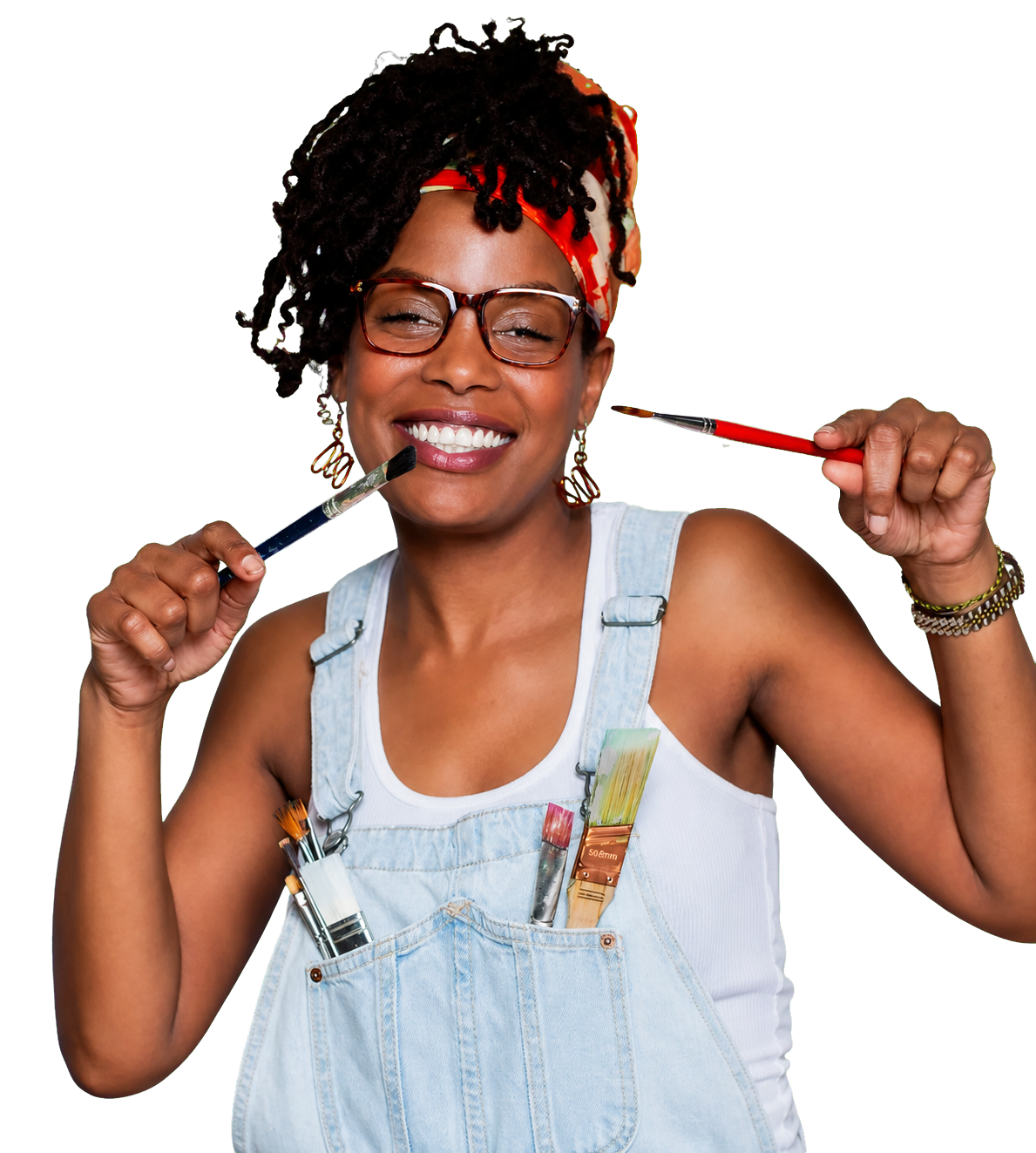 Gabrielle “Real McKoy” smiling and holding paintbrushes